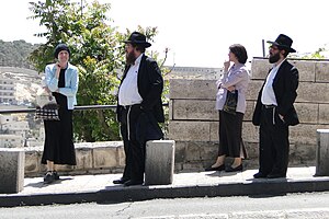Typical Haredi dress for men and women