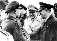 Hitler (right) visiting Berlin defenders in early April 1945 with Hermann Göring (centre) and Chief of the OKW Field Marshal Wilhelm Keitel (partially hidden)
