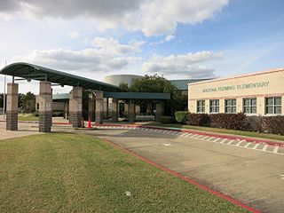 Photo of a school building with the lettering "Arizona Fleming Elementary".