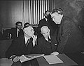 Image 42John L. Lewis (right, President of the United Mine Workers, confers with Thomas Kennedy (left), UMW Secretary-Treasurer of the UMW, and a UMW official at the War Labor Board in 1943 about a coal miners' strike.