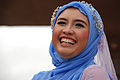 Laughing woman in Kuala Lumpur wearing a blue headscarf, 2008.