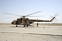 An Afghan Air Force Mi-17 helicopter sits on the ramp at Shindand Air Base in 2011.