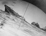 Torpedoed Japanese destroyer Yamakaze photographed through periscope of USS Nautilus, 25 June 1942.