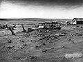 Image 11 Dust Bowl Photo credit: Sloan, USDA Buried machinery in a barn lot, Dallas, South Dakota, United States, due to Dust Bowl conditions, May 1936. Dust storms from 1930–1939 caused major ecological and agricultural damage to American and Canadian prairie lands. This ecological disaster was a result of drought conditions coupled with decades of extensive farming using techniques that promoted erosion. More featured pictures