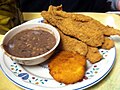 Fried catfish, purple hull peas, and hot water cornbread
