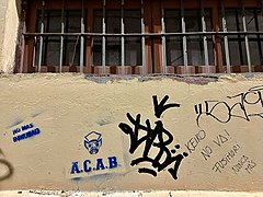 A pig above ACAB, beside anti-Fujimorism graffiti in Cusco, Peru