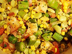 A serving of succotash, prepared with corn, lima beans, and bell peppers.
