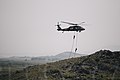 Two Turkish commandos repel from an S-70 utility helicopter in support of ground combat operations during the culminating event of Exercise Erciyes