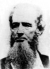 Black and white photo shows an elderly balding and bearded man.