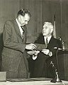 AEC chair John A. McCone presents the Enrico Fermi Award to Glenn T. Seaborg in 1959. Seaborg succeeded McCone as AEC chair in 1961.
