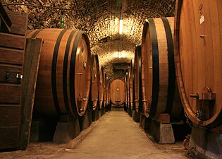Oak barrels in a winery in Chianti, Italy