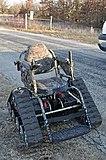 All-terrain, powered, tracked wheelchair used for hunting