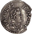 Denar imperial de argint, emis sub Carol cel Mare, bătut la Mainz (812-814), inspirat de modelele numismatice romane. Efigia din profil fără barbă, spre dreapta, cu fruntea laureată; inscripția KAROLUS IMP[erator] AUG[ustus].[33]