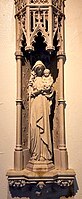 Marian Votive Shrine, Mother of the Good Shepherd. Carved in Caen stone, it was installed in the Lady Chapel in 1923 in honor of a parishioner's child who died in infancy.