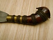 Barong hilts commonly have a metal sleeve (ferrule) and lacquered cord wound around the hilt, for a better grip