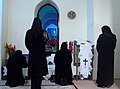 Assyrian Christian women wearing headcoverings and modest clothing praying in Mart Maryam Church in Urmia, Iran