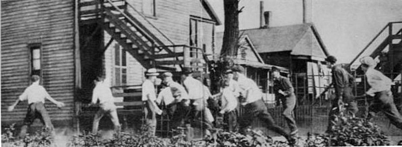 A white gang looking for African Americans during the Chicago Race Riot of 1919. This and a subsequent picture at The Crisis Magazine 1919 Vol 18 No. 6 is part of a series of the Chicago race riots of 1919. The first pictures of the white gang chasing a victim are at[32] and [33]