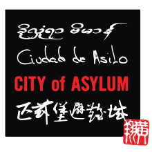 City of Asylum written in various languages serves as the organizations logo.