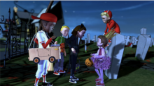 Four kids stand around in the dark on a graveyard with several gravestones close to the line between it and a regular street. From left to right, a black kid with a red cap, white shirt, blue jeans, and red sleeves inside a cardboard box, a blonde-haired boy wearing a green shirt, blue jeans, and a red piece of attire surrounding his body, a girl in an all-black suit with dark hair and cat ears, little girl with a crown, purple skirt and shirt, and pink sleeves, and a blonde-haired boy with ram horns wearing a red hoodie.