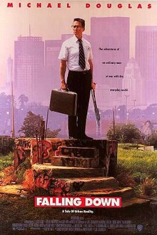 A poster depicting an older man standing on a concrete platform, wearing a business outfit, holding a briefcase and a shotgun. Above, in black letters, it reads: "Michael Douglas". Below, in large white letters over a red background, it reads: "Falling Down". Beneath that, with the film credits, it reads in small white letters: "A Joel Schumacher Film". In the background are skyscrapers and a smog filled sky.