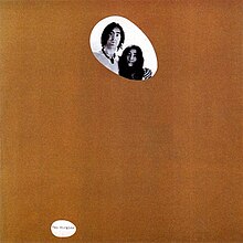 The album covered by a brown paper bag with holes cut out to show John and Yoko's faces and the text "Two Virgins"