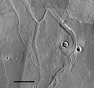 Middle portion of Enipeus Vallis. The valley divides into several channels, forming large central island at 37.0°N, 267.2°E. Image is THEMIS VIS mosaic.