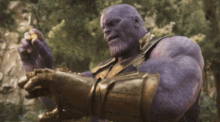 Thanos places the Mind Stone into the Infinity Gauntlet, which is the sixth and final Stone he needed. A surge of energy from the Stones then goes through his body.