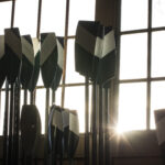 photo of sunlight illuminating rowing oars
