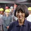 Female consultant with employees in hard hats