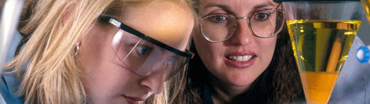 Female student and professor in chemistry lab