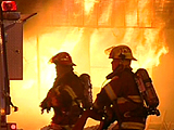Firefighters battle the blaze in Barrie, Ont., 90 km north of Toronto, early Friday, Dec. 7, 2007.