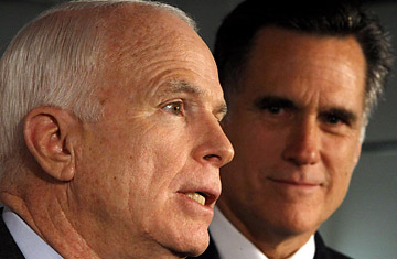 Former Republican presidential hopeful, Mitt Romney, right, looks on as Republican presidential hopeful, Sen. John McCain, R-Ariz. speaks during a news conference in Boston