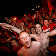 Fans outside Old Trafford celebrating Manchester United's victory over Chelsea in the Champions League final