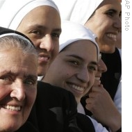 Nuns attend an open-air canonization ceremony in St. Peter's square at the Vatican, 12 Oct 2008