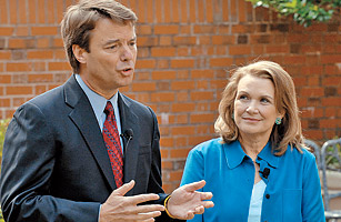 Elizabeth Edwards listens to her husband, Democratic presidential hopeful John Edwards speak at a news conference concerning the return of her cancer March 22, 2007 in Chapel Hill, North Carolina.