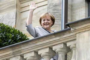 German Chancellor Angela Merkel waves as she arrives at the "Festspielhaus" in the southern German city of Bayreuth on July 25, 2009. Merkel, who is married (although she has no children) holds the No. 1 place.