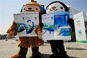 (L-R) Quatchi and Miga, the 2010 Winter Olympic mascots show the ticket designs to the media at the VANOC headquarters