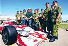 Indy driver Paul Tracy visits with soldiers and their families at the Edmonton Garrison on Thursday. He calls them "the real heroes."