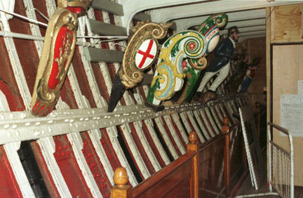 Photo in hold showing figureheads.