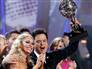 Image: Donny Osmond holding mirror ball trophy