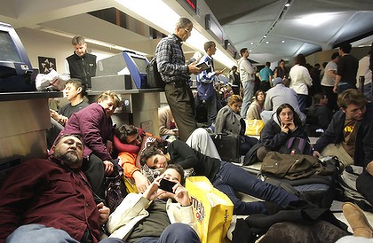 Passengers fill the terminal after a security breach shut down Terminal C at Newark Liberty International Airport.