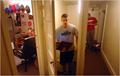 Fourteen players, including Jon Jaques, left, Aaron Osgood, center, and Alex Tyler, and a team manager live together in a three-story house near campus.
