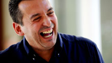 File photo of author Christos Tsiolkas, laughing