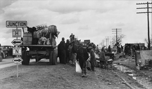 Arthur Rothstein, State highway officials moving sharecroppers away from roadside to area between the levee and the Mississippi River, New Madrid County, Missouri, January 1939. FSA-OWI Collection, Library of Congress, LC-USF33- 002975-M2.