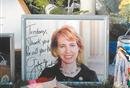 A portrait  of Congresswoman Gabrielle Giffords sits Monday at a makeshift  memorial outside her Tucson hospital.