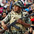 People celebrate as the Egyptian army is seen close to Cairo's Tahrir Square on February 12, 2011
