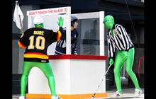 The Green Men take to the streets on Georgia And Thurlow ahead of the Vancouver Canucks' away game against the Nashville Predators in Vancouver May 3.
