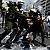 A demonstrator is grabbed by riot police during clashes near the Greek parliament on June 28, 2011