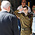 Released Israeli soldier Gilad Shalit salutes Israeli Prime Minister Benjamin Netanyahu as he disembarks from an army helicopter at Tel Nof air base in Israel on Oct. 18, 2011