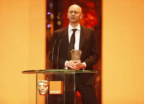 Chris Dickens collects Slumdog Millionaire's second BAFTA of the night for Editing (BAFTA / Marc Hoberman).